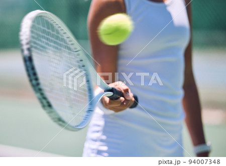 Closeup tennis ball, racket and sport for fit, active and healthy player hitting, training and exercising for practice. Porfessional player warming up for routine workout and exercise match on court 94007348