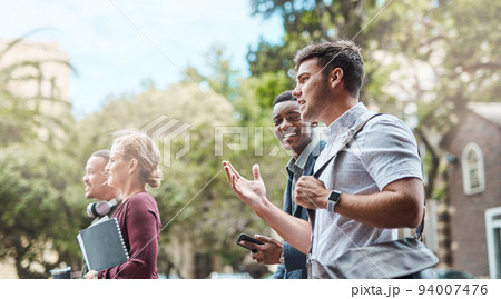 Students, creative team and conversation outside while walking and talking about ideas and innovation. Explaining our vision while traveling through the city for a business meeting with colleagues 94007476