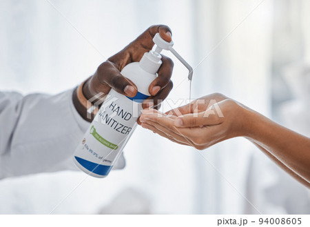 Doctor apply hand sanitizer cleaning, hygiene and covid procedures during quarantine. Medical, healthcare and safety professional disinfecting their hands to protect from corona virus or covid19 94008605