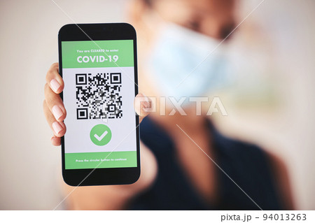 Covid passport, QR code and phone in the hand of a woman refugee or passenger ready for immigration and travel. Closeup of 5g mobile technology for safety during the global corona virus epidemic Covid passport, QR code and phone in the hand of a woman refugee or passenger ready for immigration and travel. Closeup of 5g mobile technology for safety during the global corona virus epidemic 94013263