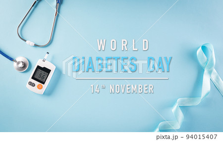 World diabetes day awareness concept, stethoscope with blue ribbon and sugar test set on pastel background,  14 November. 94015407