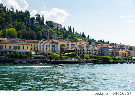 View from Lake Como to the city of Bellagio on a sunny day.  94016254
