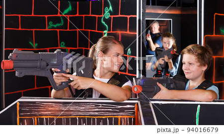 Glad boy and his mother aiming laser guns Glad boy and his mother aiming laser guns 94016679
