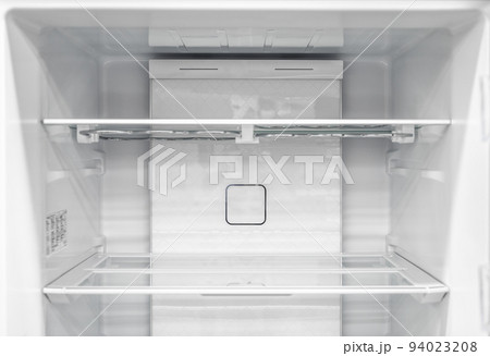 Inside of clean and empty refrigerator with shelves. background for health or diet concept. empty shelves for products. New clean refrigerator. 94023208