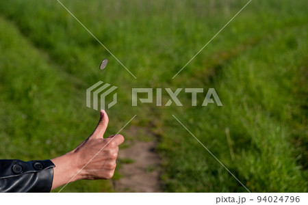 Choice of solution. Tossing a coin at a fork in a forest path 94024796