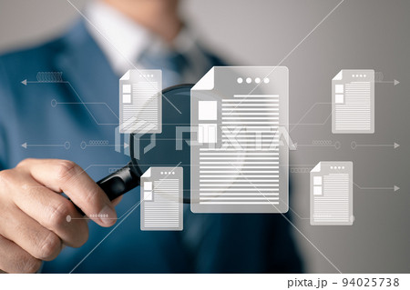 A man examines a paper with a magnifying glass. Business analysis, audit, professional documentation review, inquiry, and inspection concepts. 94025738