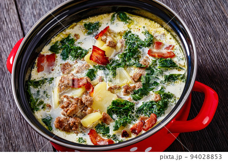 Zuppa Toscana,Tuscan Soup in red pot, top view 94028853