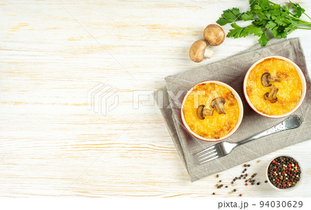 French Julienne casserole with chicken and mushroom in portion ramekin on white background French Julienne casserole with chicken and mushroom in portion ramekin on white background 94030629