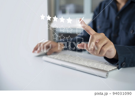 Satisfaction and customer service survey concept, business people using  smartphone. to answer the questionnaire And the satisfaction rating, the satisfaction rating with the icon 5 stars. 94031090