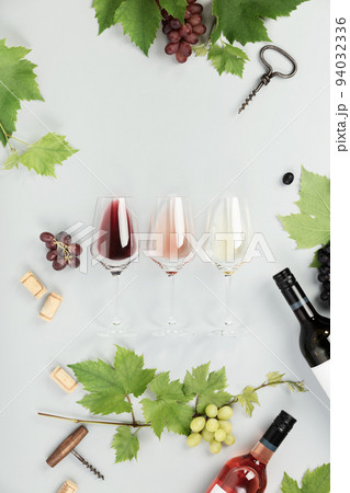 Flat-lay of red, rose and white wine in glasses on white background 94032336