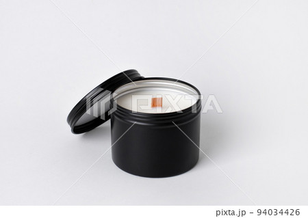 Soy candles in metal cans, handmade modern hobby , harmless coconut wax candles without paraffin on white background isolated 94034426