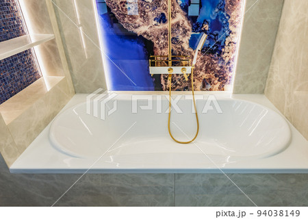 Bath in the bathroom inside of the flat. 94038149