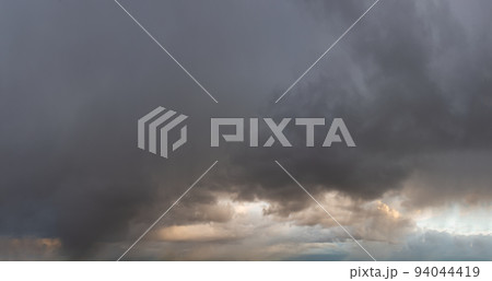 Fantastic thunderclouds at sunrise 94044419
