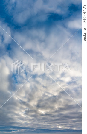 Fantastic clouds at sunrise, vertical panorama Fantastic clouds at sunrise, vertical panorama 94044425