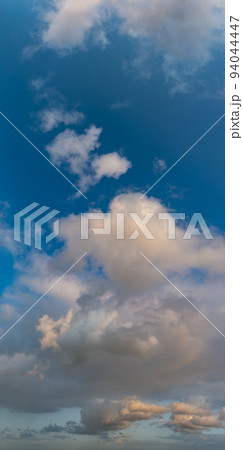 Fantastic clouds at sunrise, vertical panorama Fantastic clouds at sunrise, vertical panorama 94044447