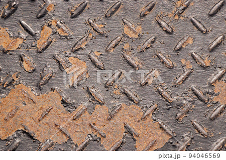 Black color non-slip metal with red rust textured background Black color non-slip metal with red rust textured background 94046569