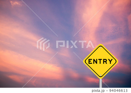 Yellow transportation sign with word entry on violet color sky background 94046613
