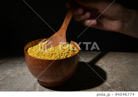 Raw Amorphous Pollen On A Wooden Spoon 94046774
