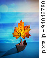 Paper Boat With A Maple Leaf On A Pond 94046780