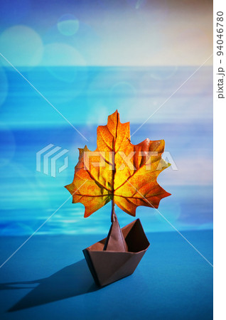 Paper Boat With A Maple Leaf On A Pond 94046780