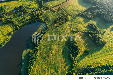 Lyepyel District, Vitebsk Region, Belarus. Aerial View Of Residential Area With Houses In Countryside. Sunny Autumn Morning. Sun Shining Above Town Skyline And Lepel Lake. Flat View 94047525