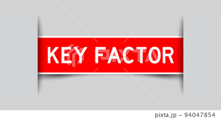 Inserted red color label sticker with word key factor on gray background 94047854
