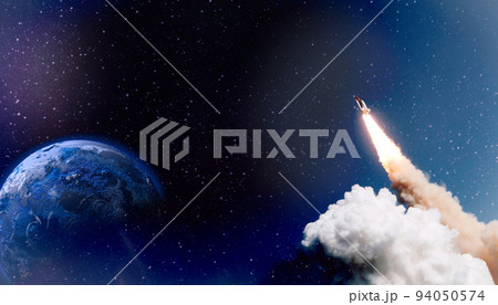 Spaceship flight. Starry sky and blue galactics. View on space shuttle and milky way. Elements of this image furnished by NASA Spaceship flight. Starry sky and blue galactics. View on space shuttle and milky way. Elements of this image furnished by NASA 94050574