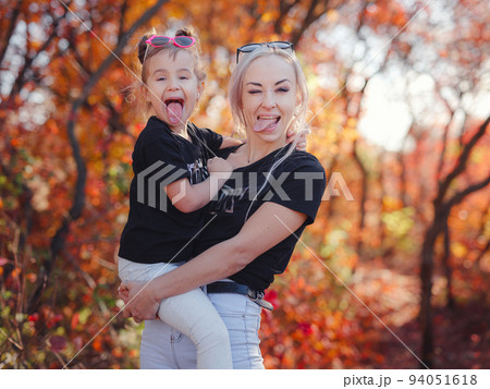 Beautiful young happy mother with little girl. 94051618