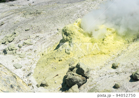 sulfur deposits around a solfatara in a fumarole field on the slope of a volcano 94052750