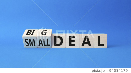 Big deal and small deal symbol. Turned cubes with words Big deal and small deal. Beautiful blue background. Business concept. Copy space 94054179
