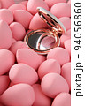beauty background a bunch of pink gentle makeup sponges and a mirror vertical orientation 94056860