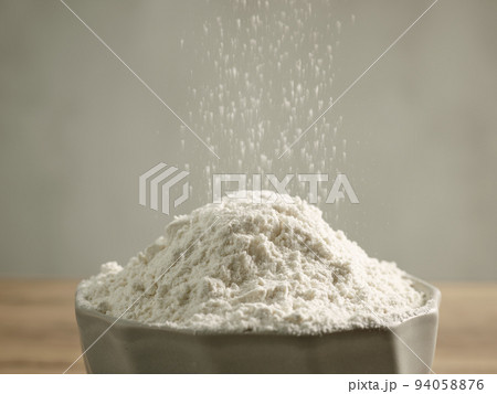 flour pouring into bowl 94058876
