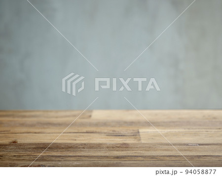 Wooden table and grey wall 94058877
