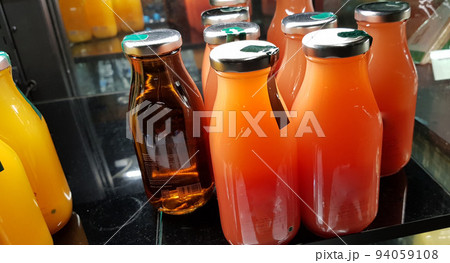 orange juice, mix fruit juice and apple juice inside the display fridge orange juice, mix fruit juice and apple juice inside the display fridge 94059108
