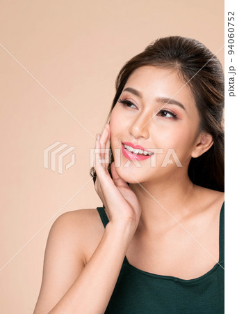 Closeup portrait of ardent young girl with healthy skin posing beauty gesture. 94060752