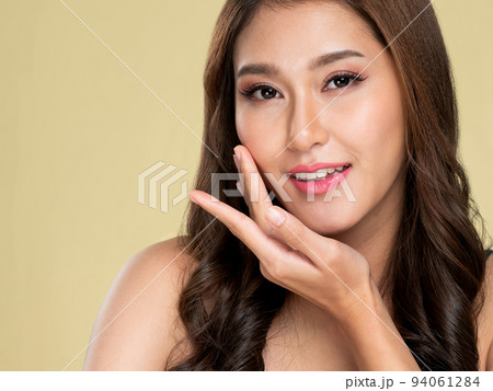 Closeup portrait of ardent young girl with healthy skin posing beauty gesture. 94061284