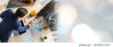 Group business people handshake at meeting table in widen view 94061354