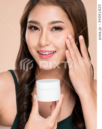 Closeup ardent woman smiling holding mockup product for advertising text place. 94061820