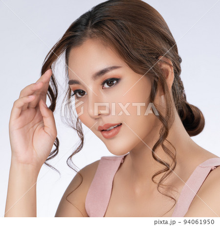 Close up gorgeous young girl posing beauty gesture with clean fresh skin. 94061950
