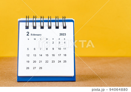 The February 2023 Monthly desk calendar for 2023 on yellow background. 94064880