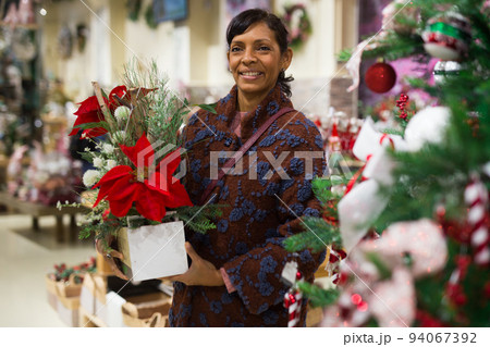 Latin woman shopping in home goods store in christmas time 94067392