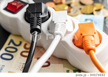 Electric plugs, socket and euro money. Concept of increasing electric prices. Electric plugs, socket and euro money. Concept of increasing electric prices. 94074692
