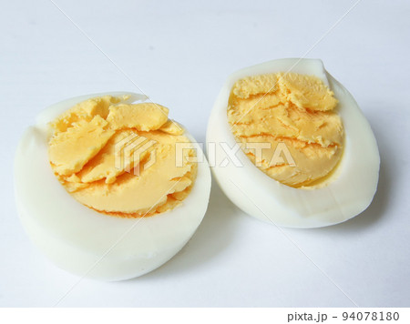 Boiled chicken egg, yolk and white on a light background Boiled chicken egg, yolk and white on a light background 94078180