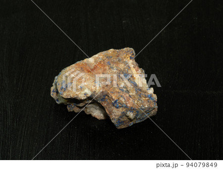 Azurite chessylite from Morocco. Natural mineral stone on black background. Mineralogy, geology, magic of stones, semi-precious stones and samples of minerals. Close-up macro photo. 94079849