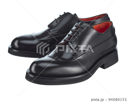 Elegant pair of men's derby shoes made of glossy black leather, lace-up, with beautiful highlights on the surface, isolated on a white background. Elegant pair of men's derby shoes made of glossy black leather, lace-up, with beautiful highlights on the surface, isolated on a white background. 94080153