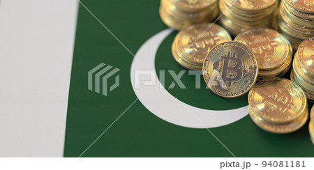 Pile of bitcoins and flag of Pakistan. National cryptocurrency regulations conceptual 3d rendering 94081181
