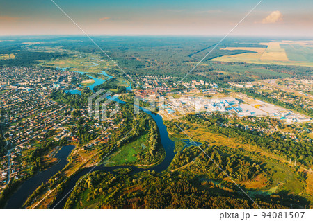 Aerial View Of Town Village Cityscape Skyline In Summer Sunny Morning. Daytime. Residential Houses, River Divides Small European City. Residential Areas And Industrial Area 94081507