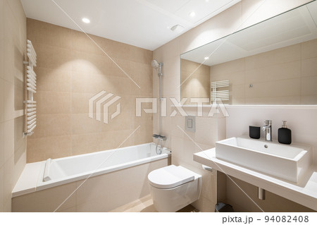 Modern bright bathroom in renovated luxury apartment. Modern bright bathroom in renovated luxury apartment. 94082408