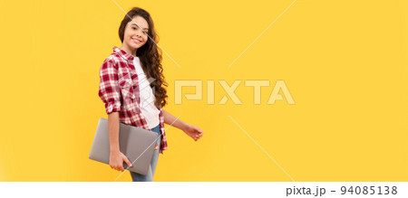 E-learning is a better way of learning. Happy girl child carry laptop. E-learning. Elearning. School girl portrait with laptop, horizontal poster. Banner header with copy space. E-learning is a better way of learning. Happy girl child carry laptop. E-learning. Elearning. School girl portrait with laptop, horizontal poster. Banner header with copy space. 94085138