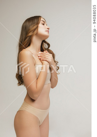 Slim sportive young woman in underwear on grey - Stock Photo [94088035]  - PIXTA